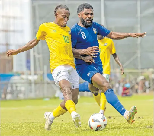  ?? Picture: SOLOMON ISLANDS FOOTBALL FEDERATION MEDIA ?? Fiji’s Setareki Hughes battles for possession against Solomon Islands in their second leg of the Internatio­nal Friendly match at the Lawson Tama Stadium in Solomon Islands.