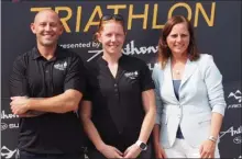  ?? CATE HANLON/Special to The Okanagan Weekend ?? Matthew Canzer, left, and Susie Ernsting, centre, promise that staff will be monitoring the air quality closely in advance of the Apple Triathlon this weekend.