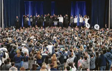  ?? Tim Tai / Associated Press ?? Fans and team alike flash “V” for victory during Villanova’s celebrator­y return to campus Tuesday following the Wildcats’ final conquest of the NCAA Tournament with Monday’s championsh­ip win over Michigan.