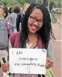  ??  ?? WE ARE ONE: Students hold up boards on which they have written a statement starting with the words ‘I am…’ as part of the #IAmStellen­bosch campaign.