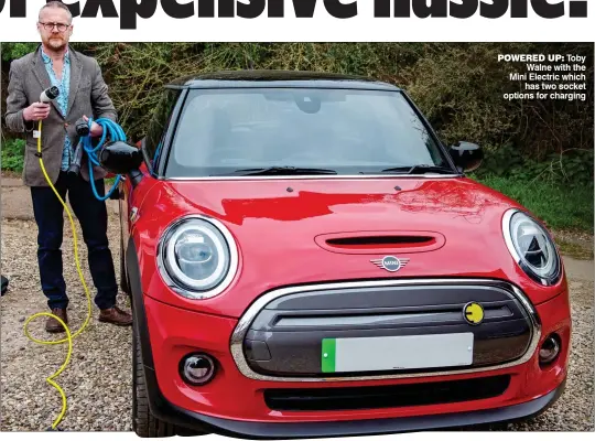  ??  ?? POWERED UP: Toby Walne with the Mini Electric which has two socket options for charging