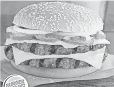  ??  ?? The Double Quarter Pound King Sandwich is direct competitio­n for McDonald’s Double Quarter Pounder. BURGER KING