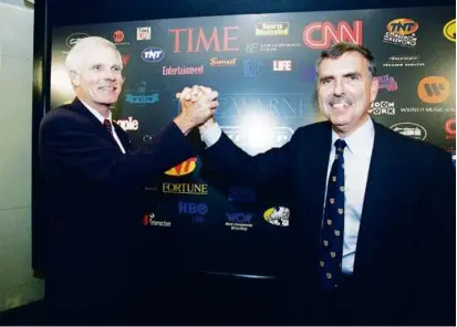  ?? RICHARD DREW/ASSOCIATED PRESS/FILE ?? Mr. Levin (right) with Turner Broadcasti­ng chairman and president Ted Turner in 1995.