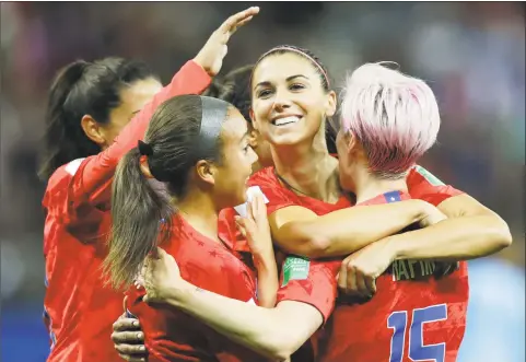  ?? Alessandra Tarantino / Associated Press ?? The United States’ Alex Morgan, second right, celebrates after scoring her side’s 12th goal during a 13-0 win over Thailand on Tuesday at the Women’s World Cup.