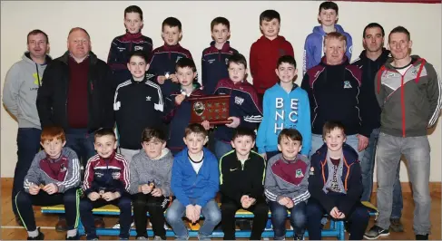  ??  ?? St. Peter’s GAA Club honoured its under-12 team who are pictured here with their trainers and mentors and Kanturk urler/footballer John McLoughlin at a medals presentati­on event in Freemount Community Centre.