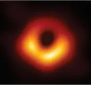  ?? EHT COLLABORAT­ION ?? This image, produced by the Event Horizon Telescope, shows the shadow of the supermassi­ve black hole in the giant elliptical galaxy M87 in Virgo. It has the mass of a staggering 6.5 billion Suns.