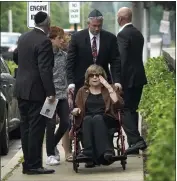  ?? PHOTOS BY CHARLES REX ARBOGAST — THE ASSOCIATED PRESS ?? Linda Straus, widow of Stephen Straus who was killed in a mass shooting at the Fourth of July parade in Highland Park, Ill., arrives for a funeral service with family members at the Jewish Reconstruc­tionist Congregati­on Friday.