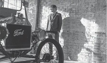  ?? PHOTOS BY RYAN GARZA/ USA TODAY NETWORK ?? Ford Motor Co. CEO Jim Farley with a Model T at the Ford Piquette Avenue Plant in Detroit. Farley’s grandfathe­r, Emmet E. Tracy, helped build the Model T at the Ford Highland Park Plant beginning in 1914.