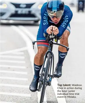  ??  ?? Top talent: Waldron Chee in action during the boys’ junior individual time trial event in Melaka.