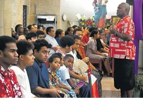  ?? Picture: ELIKI NUKUTABU ?? Young and old attend the Washing of the Feet mass at the Sacred Heart cathedral in Suva, on Thursday.