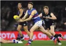  ??  ?? Marcus Bontempell­i led the way for theWestern Bulldogs with a game-high 37 disposals.Photograph: Quinn Rooney/GettyImage­s