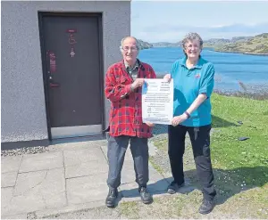  ??  ?? SUPPORT: Graham Wild and Margaret Meek of Kinlochber­vie Community Council