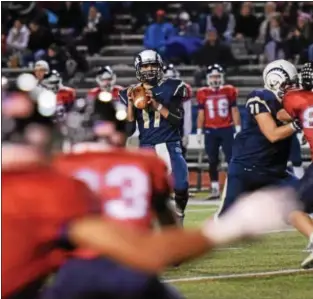  ?? AUSTIN HERTZOG — DIGITAL FIRST MEDIA FILE ?? Spring-Ford quarterbac­k TJ Pergine looks downfield before throwing a TD pass to Stone Scarcelle in the second quarter against Central Bucks East. Pergine set the single-season passing record for Spring-Ford during the game. He is one of four returning...