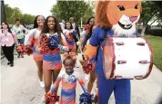  ?? CHARLES TRAINOR JR Miami Herald File ?? Florida Memorial cheerleade­rs during a ceremony celebratin­g the college’s return to football in May 2019.