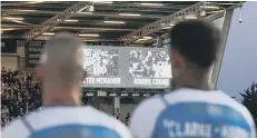  ??  ?? Former Peterborou­gh United players Peter McNamee and Robbie Cooke are shown on screen ahead of kick-off in the recent West Brom match.