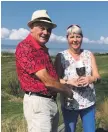  ??  ?? Machrie Bay club captain Brian Sherwood presenting The Lady Mary trophy to Jenni Turnbull who won the ladies’ summer eclectic competitio­n.