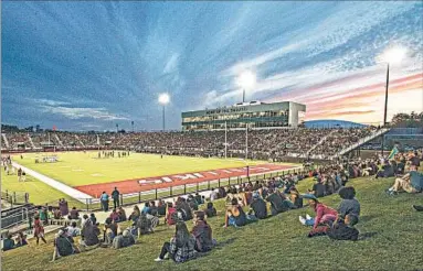  ?? STEVE BUHMAN/SIU COMMUNICAT­IONS & MARKETING ?? This is a sunset view during a football game at Southern Illinois University’s Saluki Stadium, where people will be able to watch the total solar eclipse in Carbondale on Aug. 21. Don't worry: The lights will be turned off.