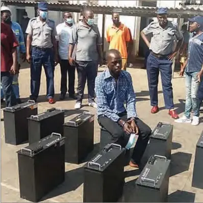  ?? Pic: Nizbert Moyo ?? Suspected solar battery thief Zenzo Moyo (36) from Iminyela suburb, Bulawayo, sits on one of the nine recovered batteries he allegedly stole from Fumugwe and Stanmore clinics in Matabelela­nd South province recently
