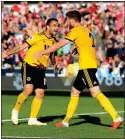  ??  ?? CLINCHER: Matt Doherty (right) celebrates with scorer Jonny Otto