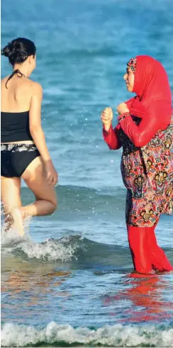  ?? Foto: AFP/Fethi Belaid ?? Umstritten­er Burkini