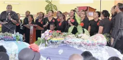  ?? PHOTO BY CHRISTOPHE­R THOMAS ?? Members of the Green Heights Assembly of God congregati­on in Green Pond, St James, deliver a musical tribute during the funeral for 43-year-old Dionne Smith and her 16-year-old daughter, Jay-Shenel Gordon, at the Farm Heights Seventh-day Adventist Church in Farm Heights, St James, yesterday.