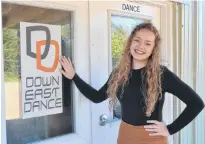  ?? SALLY COLE/THE GUARDIAN ?? Charlotte Byrne stands at the door of Down East Dance in Montague. The 18-year-old is preparing for the Dance World Cup with help from her teacher, Marie Lavergne.