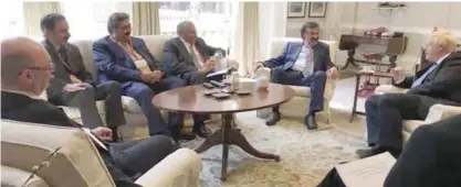  ??  ?? Kuwait’s Deputy Foreign Minister Khaled Al-Jarallah meets with British Secretary of State for Foreign Affairs Boris Johnson.