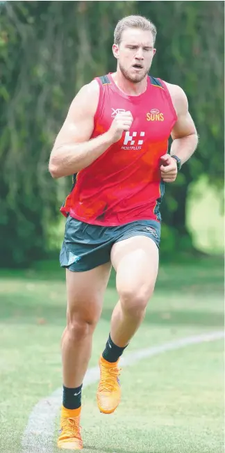  ??  ?? Sam Day returned to running at Suns pre-season training yesterday. He was joined by recruit Lachie Weller (below left) and new coach Stuart Dew (below right). Pictures: RICHARD GOSLING