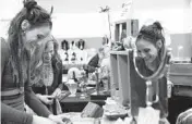  ?? JOHN J. KIM /CHICAGO TRIBUNE ?? Vendors Cassie Prigge, left, and Stephy Lou Kaiser organize items at the Randolph Street Market on April 28, 2018, in Chicago.