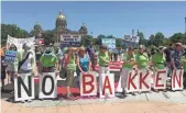  ?? WILLIAM PETROSKI, THE DES MOINES REGISTER ?? Demonstrat­ors protest the Dakota Access Pipeline at the Iowa state Capitol in June 2016. Several activist groups are listed as defendants in a federal lawsuit.