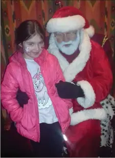  ??  ?? Caitlin, from Wexford town, pictured with Santa.