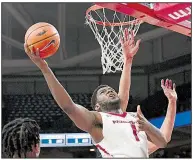  ?? NWA Democrat-Gazette/J.T. WAMPLER ?? Arkansas senior forward Trey Thompson goes to the basket during the Razorbacks’ 104-69 victory over Oral Roberts on Tuesday night at Walton Arena in Fayettevil­le.