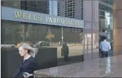  ?? Mel Melcon Los Angeles Times ?? A WELLS FARGO branch in downtown Los Angeles. The Fed has ordered the bank to stop growing.