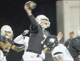  ?? Benjamin Hager ?? Las Vegas Review-journal Faith Lutheran quarterbac­k Sagan Gronauer just gets the ball off over Palo Verde lineman Landon Cooper in the second quarter Friday at Faith Lutheran High.