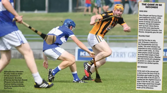  ?? Photo by Domnick Walsh / Eye Focus ?? Abbeydorne­y’s Brendan O’Leary seeks to shake off the attentions of St Brendans’ Brendan O’Connor during their Round 2B game in Austin Stack Park on Sunday evening