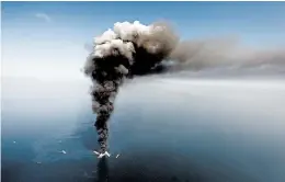  ?? GERALD HERBERT/AP 2010 ?? An explosion on the Deepwater Horizon oil rig on April 20, 2010, killed 11 workers and spilled millions of gallons of oil into the Gulf of Mexico, marring the coast from Texas to Florida.