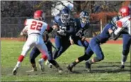  ??  ?? Pottstown’s Josiah Wiggins (12) looks for a running lane against Owen J. Roberts.