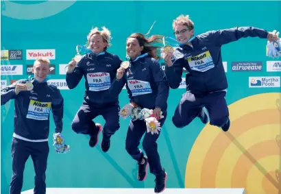  ?? Reuters ?? Oceane Maryse Jeannie Cassignol, Logan Fontaine, Aurelie Muller and Marc-Antoine Olivier of France celebrate their gold medal at the podium in Budapest. —
