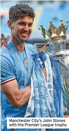  ?? ?? Manchester City’s John Stones with the Premier League trophy