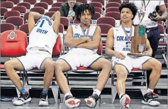  ?? [SHANE FLANIGAN/ THISWEEK NEWSPAPERS] ?? From left, Treohn Watkins, Ta’quan Simington and Trevell Adams of South reflect after falling just short in the Division II state final.