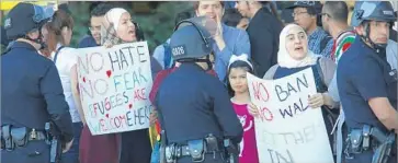  ?? Genaro Molina Los Angeles Times ?? A JANUARY protest at Los Angeles Internatio­nal Airport against President Trump’s original travel order. Trump sent tweets Monday, including one below, criticizin­g the Justice Department for revising that order.