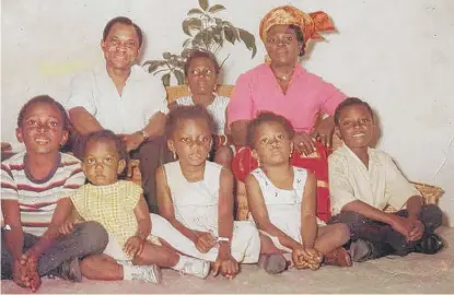  ?? FAMILYPHOT­O ?? The Ihejirika family after settling in Chicago. That's me seated second from right.