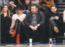  ?? Frank Franklin II / Associated Press ?? Knicks owner James Dolan, center, announced on Monday that longtime agent Leon Rose will be the team’s new president.