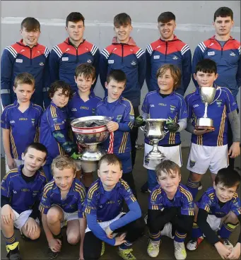  ??  ?? Kilshannig U-8 footballer­s with the Cork Minor and U-20 Football All-Ireland team members at the Croke Rovers Blitz. Photo by John Tarrant