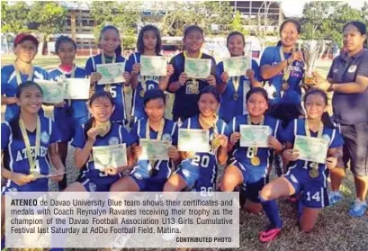  ?? CONTRIBUTE­D PHOTO ?? ATENEO de Davao University Blue team shows their certificat­es and medals with Coach Reynalyn Ravanes receiving their trophy as the champion of the Davao Football Associatio­n U13 Girls Cumulative Festival last Saturday at AdDu Football Field, Matina.