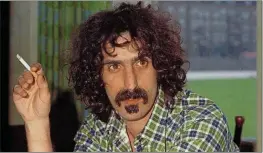  ?? THE ASSOCIATED PRESS ARCHIVES ?? American musician Frank Zappa, front man of the Mothers of Invention, in shown enjoying a cigarette in September 1972. The guitarist, who died in 1993, is now the subject of a new biography.