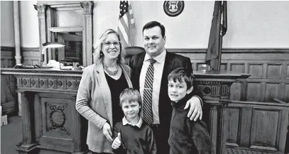  ?? COURTESY OF DANA M. VANSUMEREN ?? The VanSumeren family poses for a photo in a Michigan courtroom after Robert’s swearing-in ceremony in November.