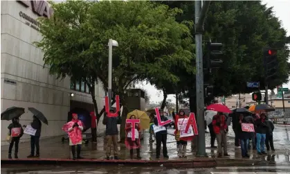  ?? ?? Teachers join the Los Angeles unified school district, (LAUSD) members as they strike in Los Angeles on Tuesday. Photograph: Damian Dovarganes/AP