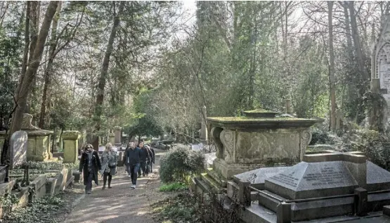  ?? — ©2024 The New York Times Company ?? Visitors to Highgate Cemetery, a Victorian graveyard where Karl Marx, George Michael and George Eliot are buried, in London in these file photos. Graves can run upwards of £25,000, and the cemetery is trying to add more space.