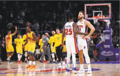  ?? Paul Sancya / Associated Press ?? Detroit guard Reggie Bullock consoles Blake Griffin after he missed a three-point try at the buzzer that would have tied it against the Bucks. Griffin had a quadruple double — 19 points, 11 assists, 10 rebounds and 10 turnovers — in the Pistons’ narrow loss. “I was unbelievab­ly awful tonight,” Griffin said.